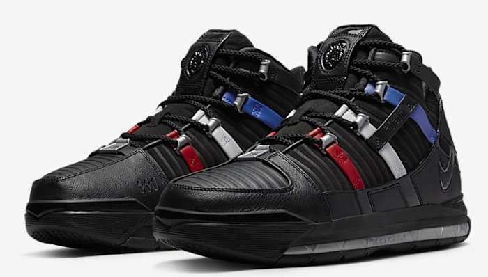 Side view of LeBron James' black and red Nike shoes.